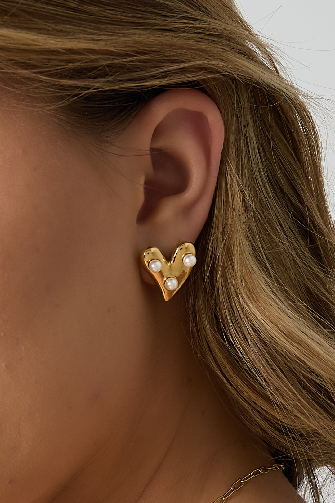 Boucles d'oreilles en forme de cœur avec des perles