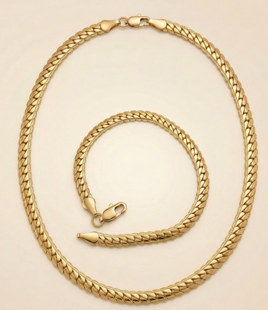 parure Velis comprenant un collier et un bracelet maille serpent plate en acier inoxydable 316L de couleur dorée